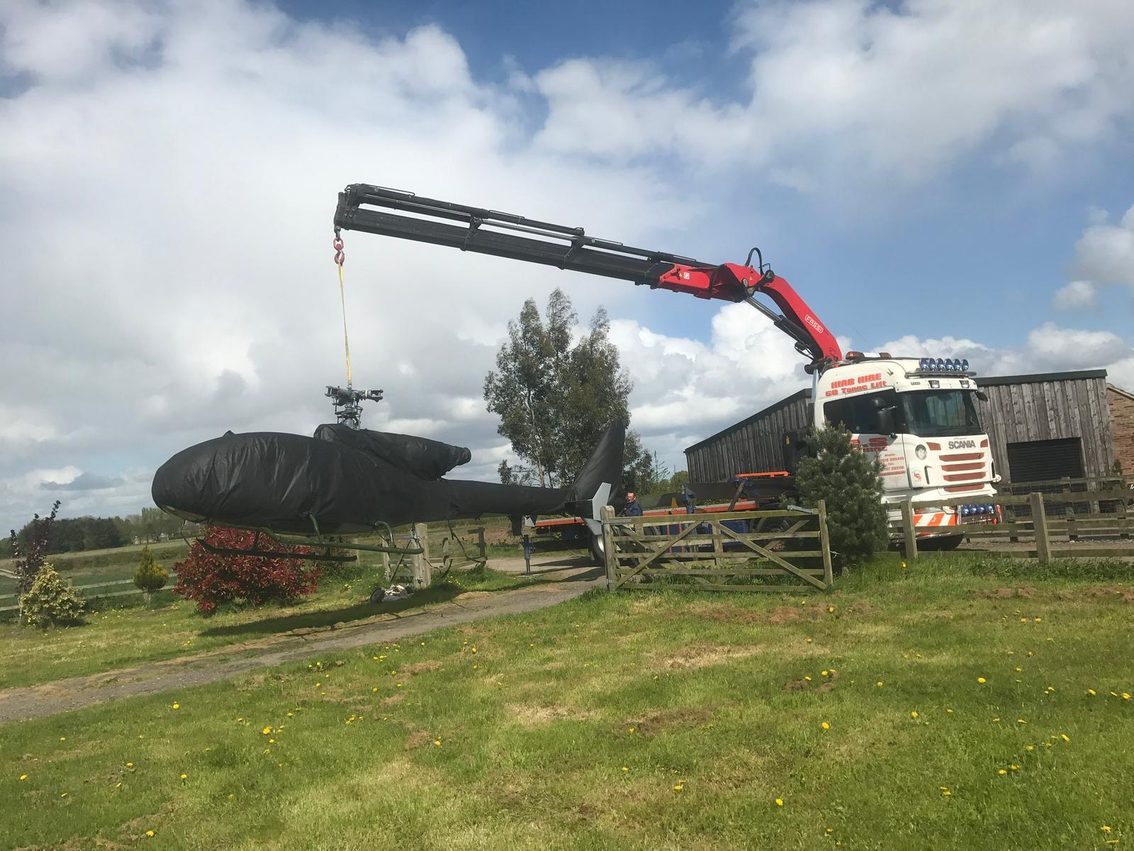 LCS vehicle crane lifting a boat at the harbour